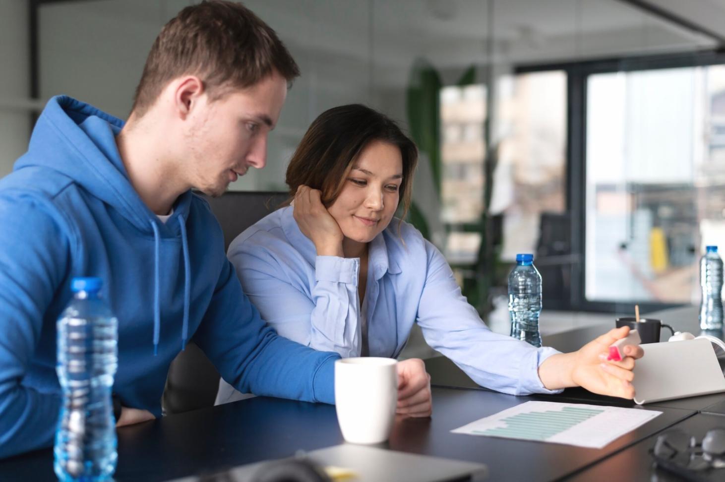 Person reviewing personal finances with calculator and documents